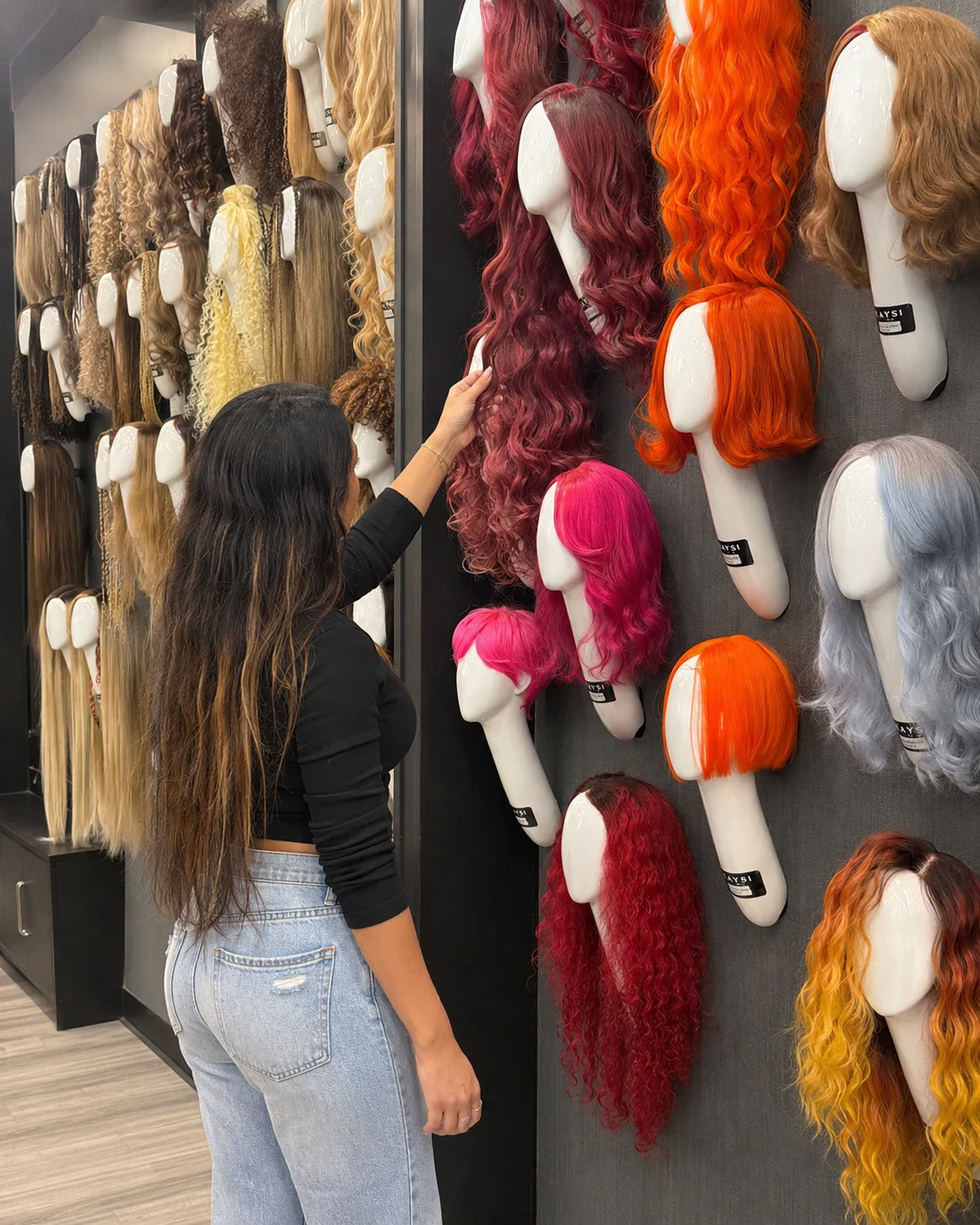 Wall of wigs in a Kaysi Beauty store